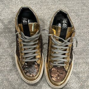 P448 Great condition Sequins gold and chrome with black. Size 40